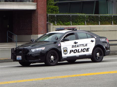 Seattle police - The report says a number of Seattle police officers left the department in September, decreasing the department from 1,247 to 1,203 officers in a single month.